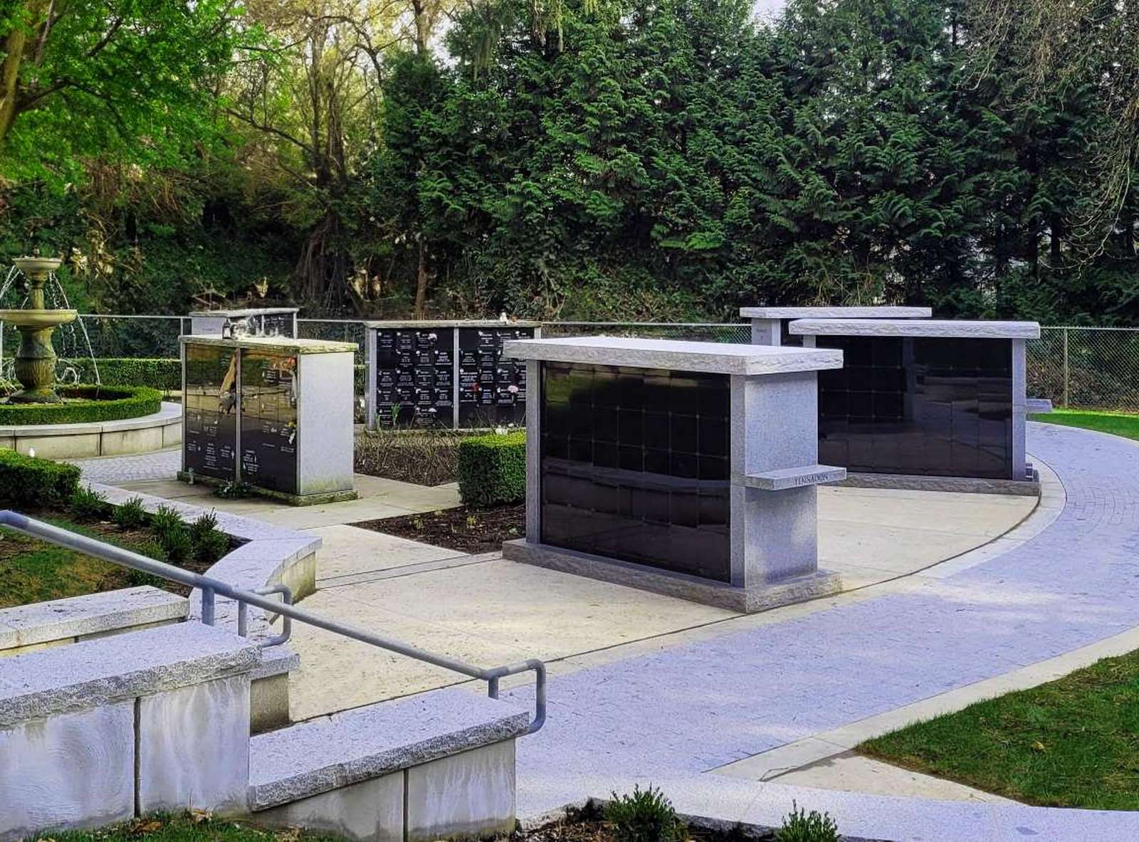 The Chelmsford columbarium model featured in a garden setting, designed with double siding to accommodate additional niches for urns